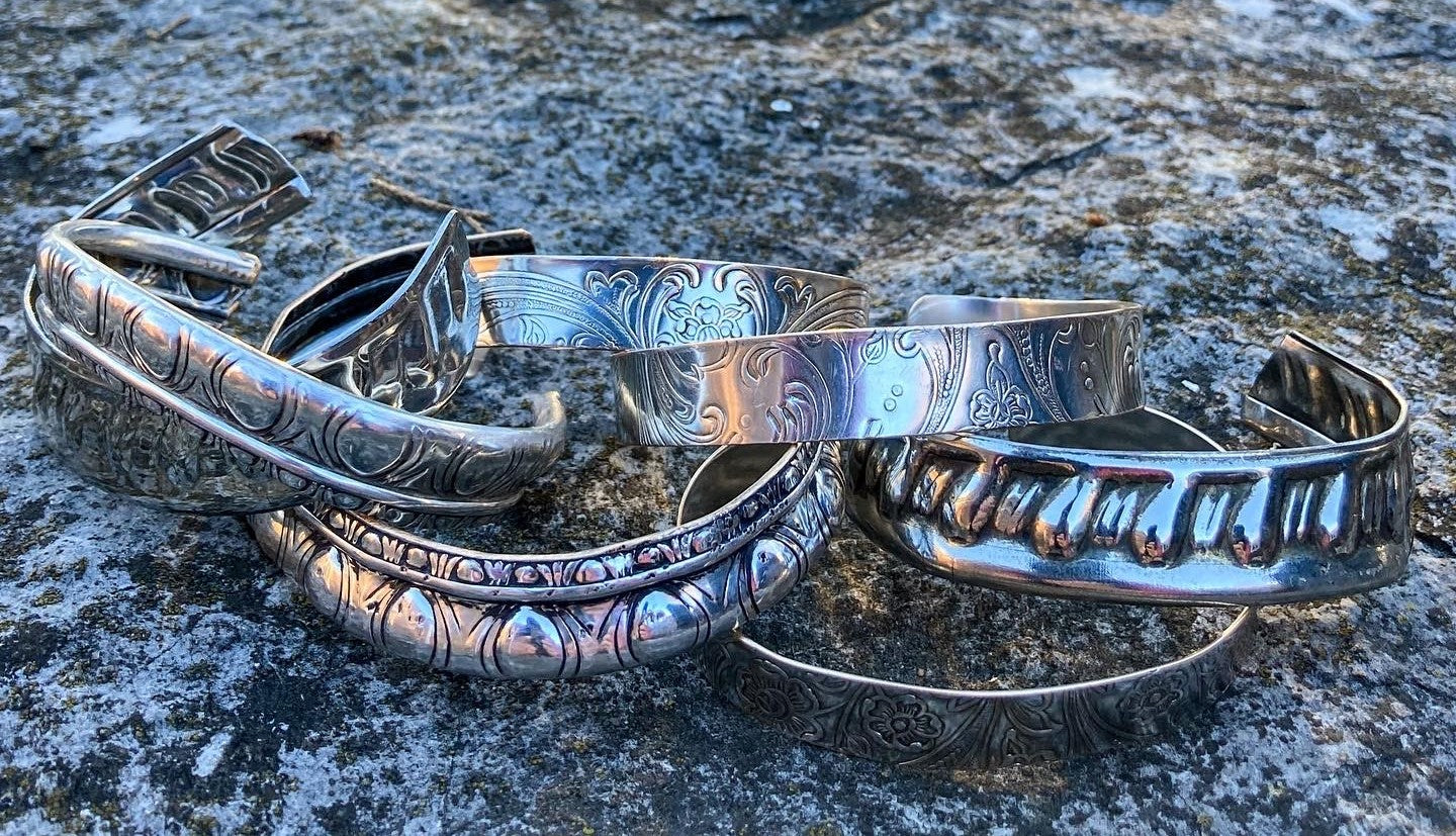 multiple silver bracelets created from vintage silver platters